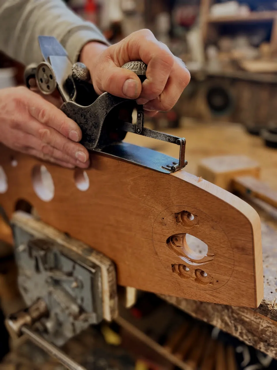 Working an ash frame member with a hand plane